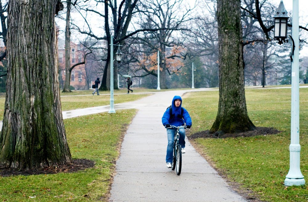 Dietetics junior Seth Walton rides his bike through campus on his way home Wednesday afternoon. MSU was recently awarded the Bicycle Friendly University Bronze Award by the League of American Bicyclists, making MSU the only university in the state to receive the honor. Matt Hallowell/The State News