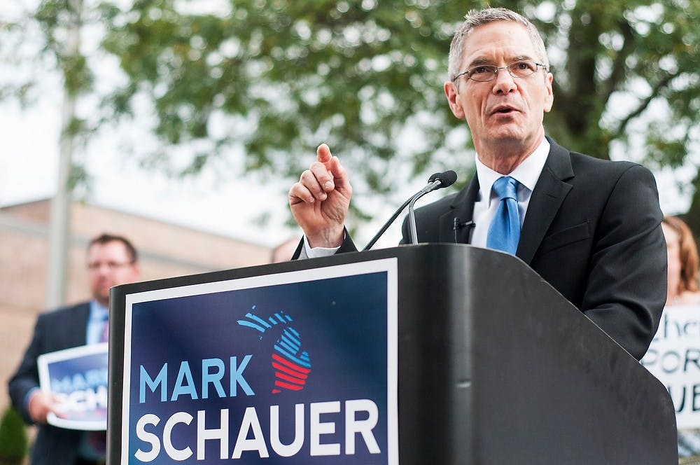 	<p>Gubernatorial candidate Mark Schauer addresses the media and supporters Oct. 1, 2013 outside Riddle Middle School in Lansing. Schauer is an alumnus of <span class="caps">MSU</span> with a master&#8217;s in political science. Khoa Nguyen/The State News</p>