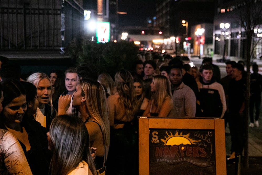 A line of people wait outside Harper's after MSU cancelled classes due to coronavirus March 11, 2020.