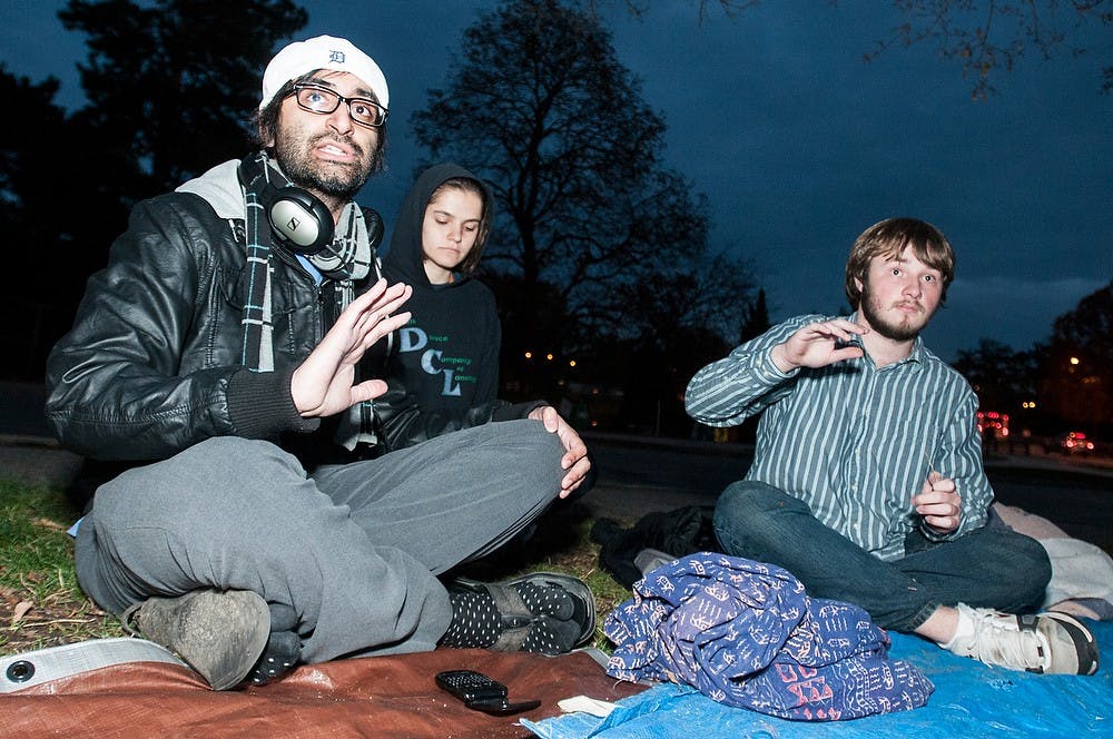 	<p>Doctoral student Zain Shamoon talks during a gathering led by the College Assistance Migrant Program Scholars Initiative (<span class="caps">CAMP</span>) on Thursday, Oct. 18, 2012 by the rock on Farm Lane. Shamoon, who is not a part of <span class="caps">CAMP</span>, decided to join the group to discuss issues with the administration. Julia Nagy/The State News</p>