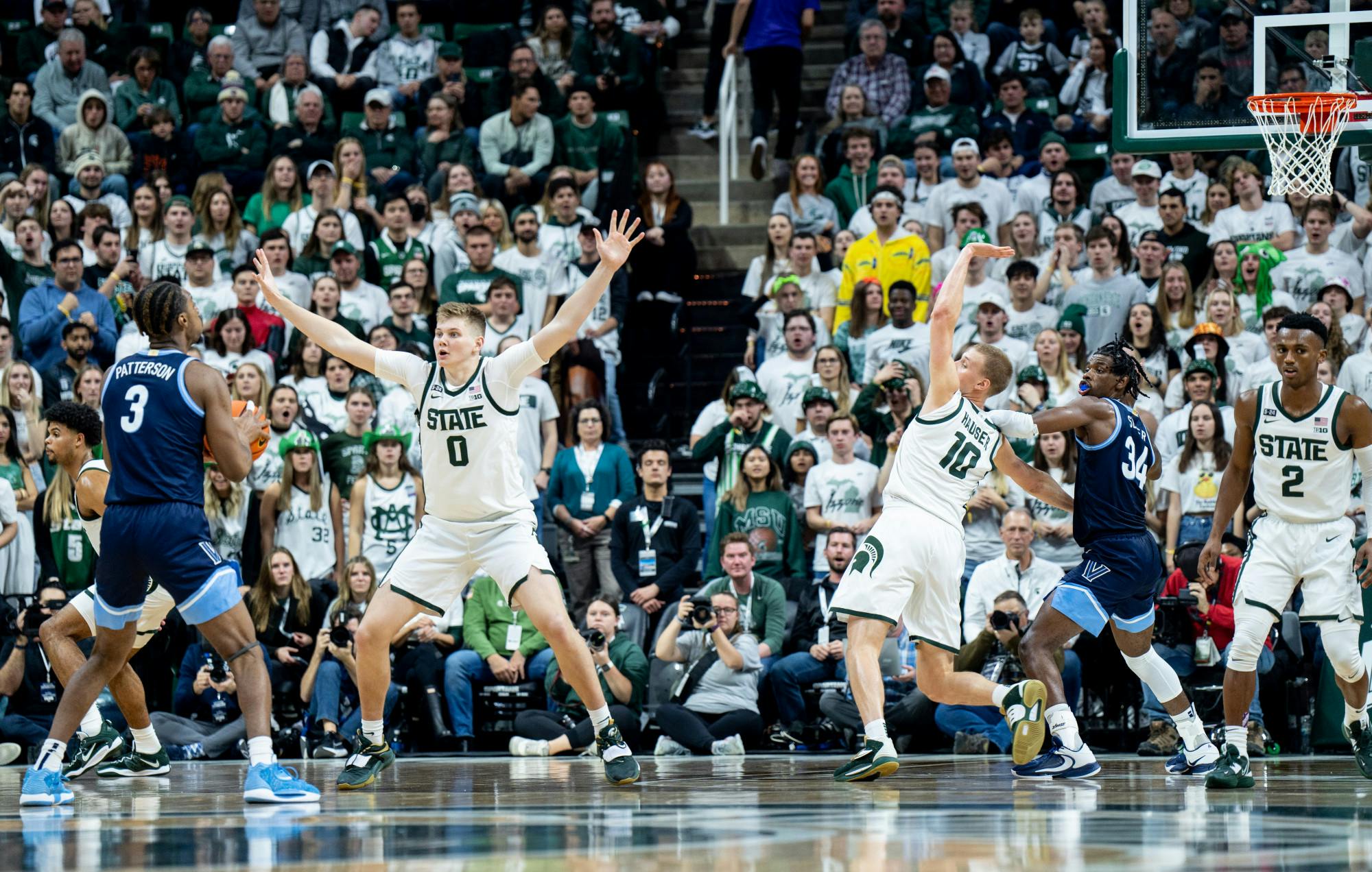 Freshman forward Jaxon Kohler (0) and graduate student forward Joey Hauser (10) guard their opponents during a game against Villanova at the Breslin Center on Nov. 18, 2022. The Spartans defeated the Wildcats 73-71. 