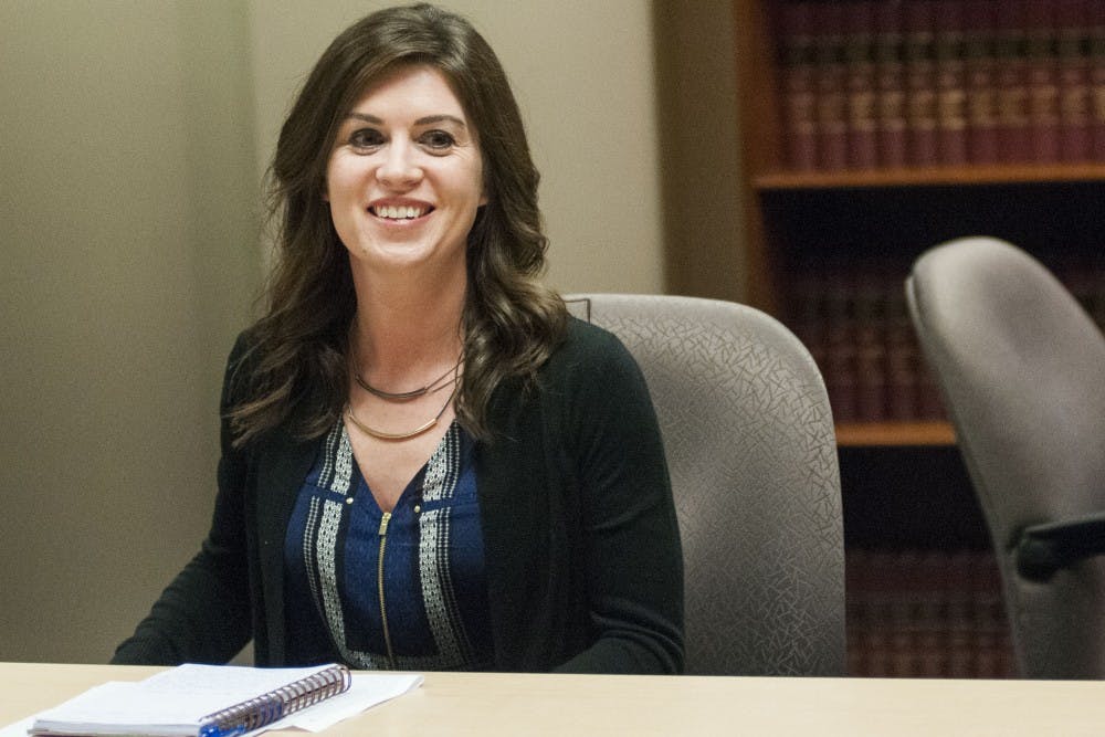 Lansing resident Larissa Boyce smiles while being interviewed about former MSU employee Larry Nassar on March 24, 2017 at Church Wyble P.C. at 2290 Science Parkway in Okemos. Boyce, a former MSU gymnast sexually abused by Nassar, has decided to dismiss anonymity in order to encourage change and challenge stigma. "When your house is robbed, you come forward. Well, our bodies were robbed," Boyce said. 