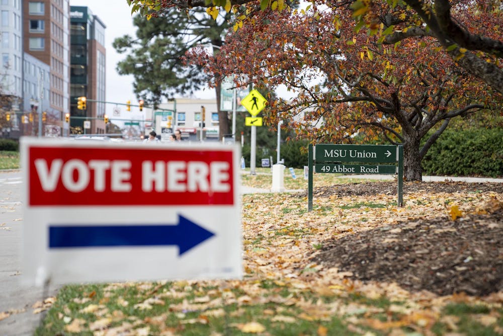<p>A vote here sign pointing to the Michigan State University Union showing people where they can cast their vote for the presidential election on Nov. 5, 2024.</p>