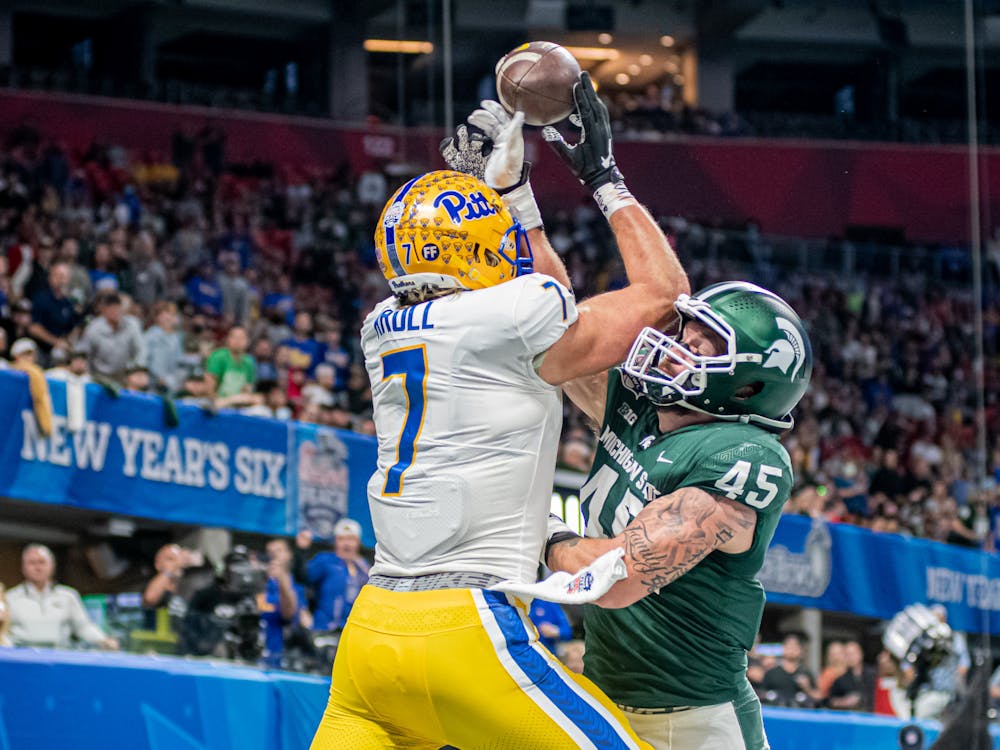 <p>Michigan State redshirt senior linebacker Noah Harvey breaks up a pass in the end zone during the Chick-fil-A Peach Bowl on Dec. 30, 2021</p>