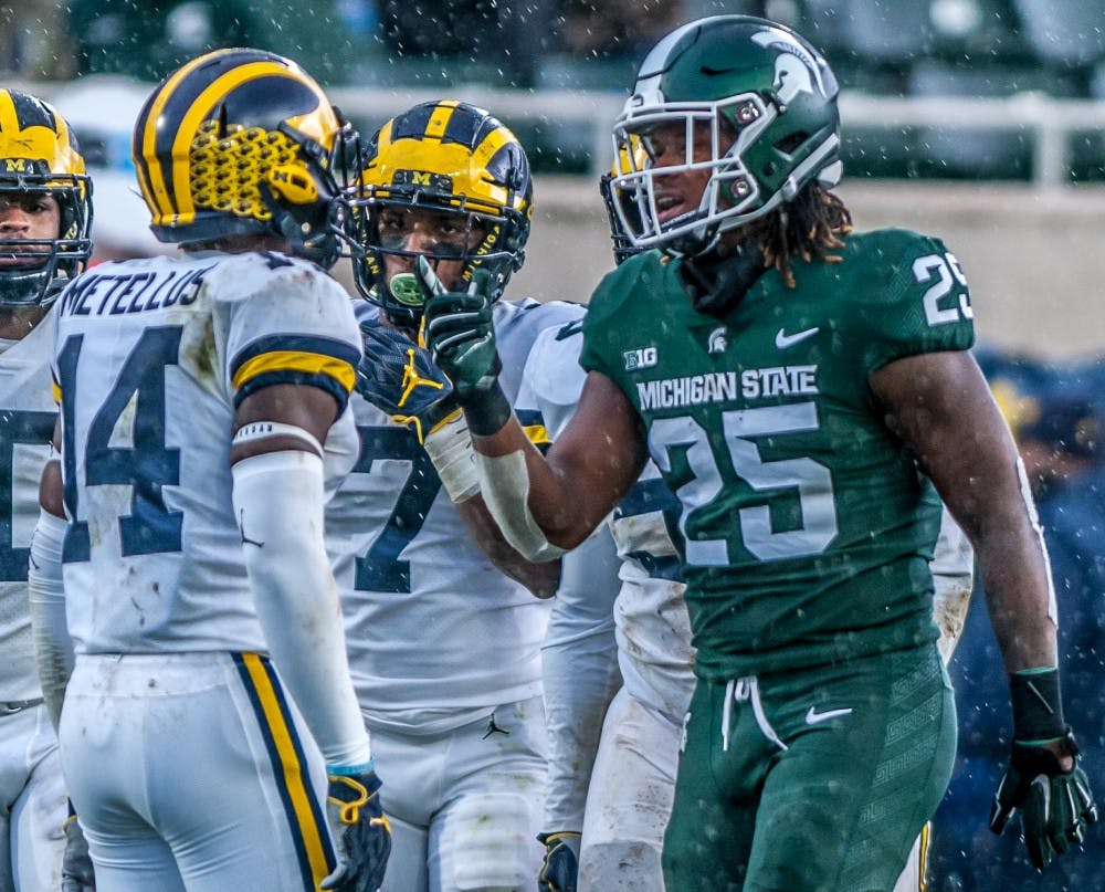 Junior wide receiver Darrell Stewart Jr. (25) points towards Michigan defensive back Josh Metellus (14) after a play during the game against Michigan on Oct. 20, 2018 at Spartan Stadium. The Spartans lost to the Wolverines 21-7.