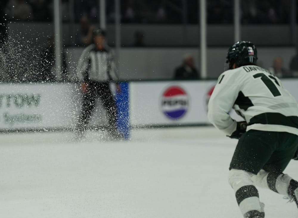 <p>Michigan State Spartans forward Jeremy Davidson (11) kicks up ice in a game against the Wisconsin Badgers on Nov. 17, 2023 at Munn Ice Arena.</p>