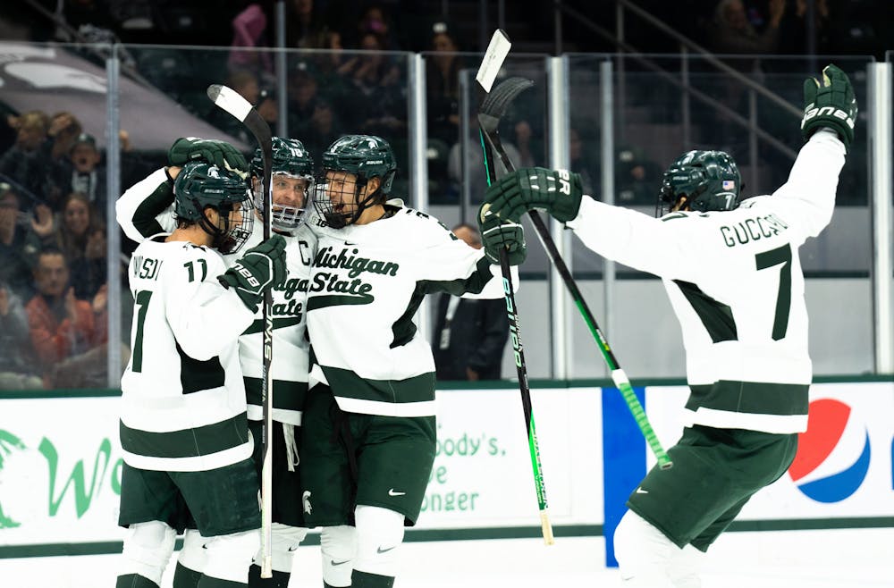<p>MSU hockey celebrates after scoring a goal against the University of Massachusetts at Munn Ice Arena on Oct. 13, 2022. The Spartans defeated the Minutemen with a score of 4-3. </p>