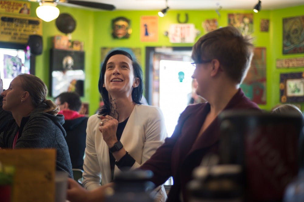 Ithaca, Mich. resident Abby Staley, left, and Holt, Mich. resident Jesse Slocum laugh together on June 8, 2016 at Golden Harvest at 1625 Turner St. in Lansing, Mich.