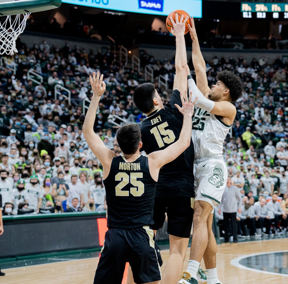 <p>Sophomore center Zach Edey blocks junior forward Malik Hall&#x27;s shot during No. 4 Purdue&#x27;s loss to Michigan State on Feb. 26, 2022, at the Breslin Center.</p>