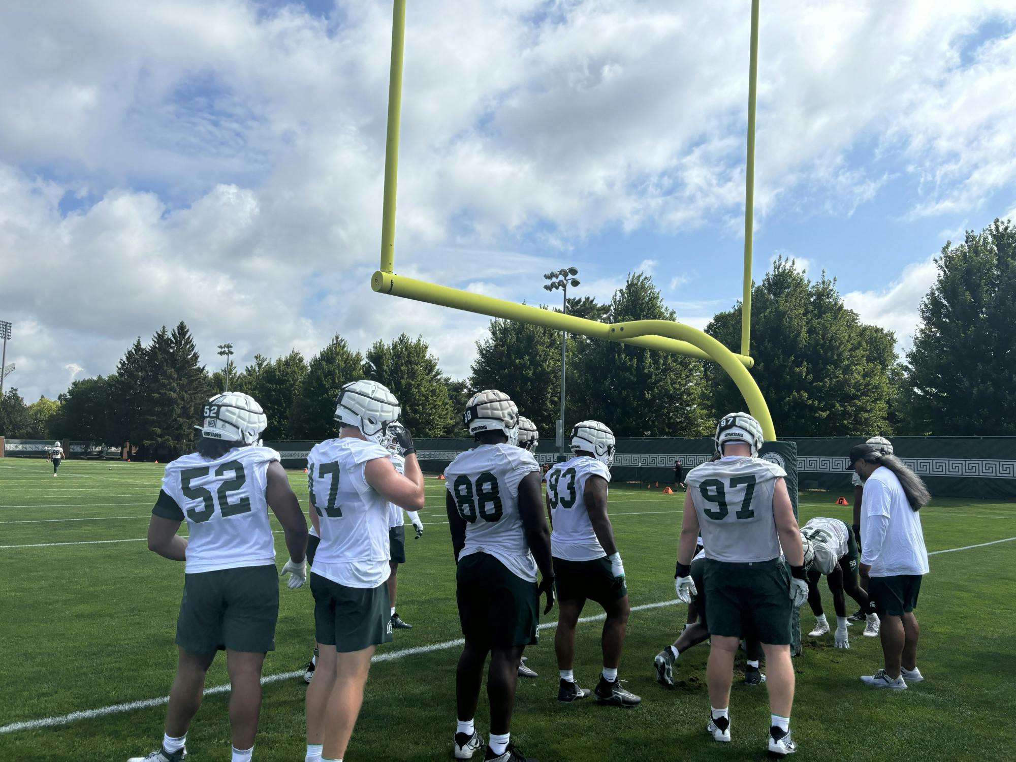 <p>Players of the Michigan State football team waiting to start a drill during a preseason practice on July 30, 2024. Courtesy of PJ Pfeiffer.</p>