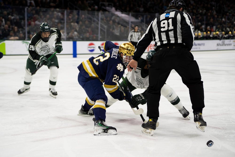 <p>Notre Dame Freshman Forward Cole Knuble (22) faces off against Michigan State Junior Forward Red Savage (21) during their game at Munn Arena on Dec. 8, 2023. Savage's Spartan Squad defeated the visiting Irish 5-2.</p>