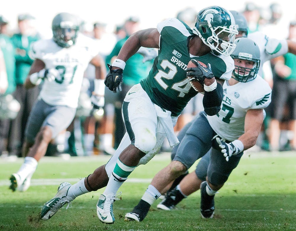 	<p>Junior running back Le&#8217;Veon Bell escapes linebacker Justin Cudworth on Saturday, Sept. 22, 2012, at Spartan Stadium. Bell contributed a career high 253 yards in the Spartans victory over <span class="caps">EMU</span>. State News File Photo</p>