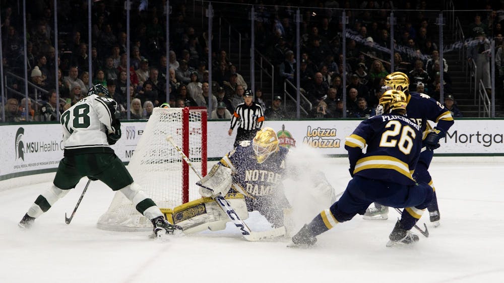 <p>Notre Dame Graduate Student Goaltender Ryan Bischel gets snowed by his own teammates during their game against Michigan State at the Munn Arena on Dec. 8, 2023. Michigan State would go on to win 5-2.</p>