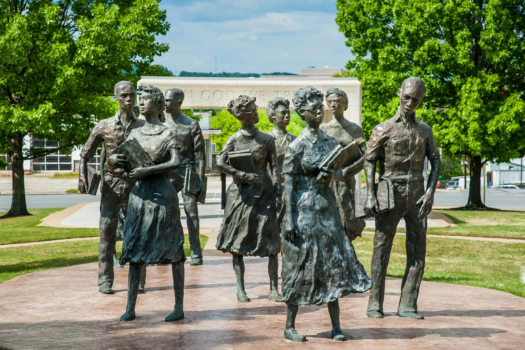 <p>“Testament: The Little Rock Nine Monument” honors the courage of the nine African American students who began the process of desegregating Little Rock’s public schools in 1957. Located on the grounds of the Arkansas State Capitol, the memorial features bronze sculptures of the nine students, along with plaques bearing quotations from each of them. (Photo courtesy of Arkansas Department of Parks, Heritage and Tourism)<br/><br/></p>