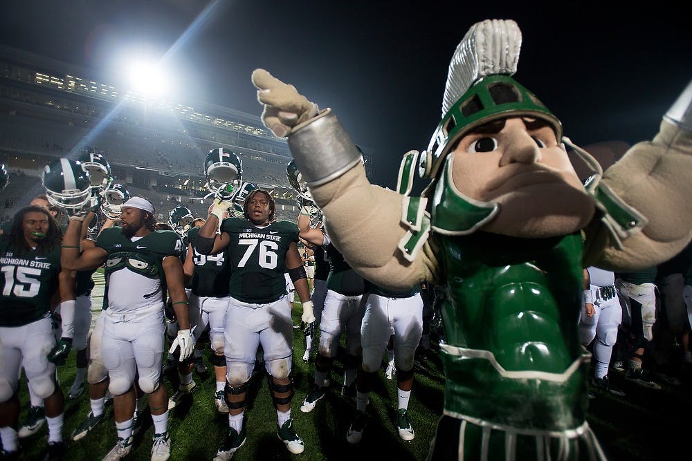 	<p>The Spartans celebrate their win against Western Michigan on Aug. 30, 2013, at Spartan Stadium. The Spartans defeated the Broncos 26-13. Julia Nagy/The State News</p>