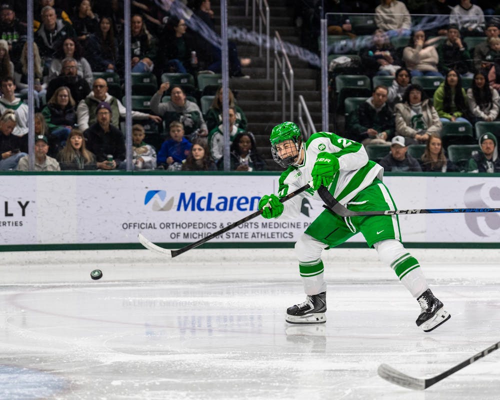 MSU Fr. F, Anthony Romani (21), takes a shot on goal in Munn Ice Arena in East Lansing, MI on Feb. 19, 2026.