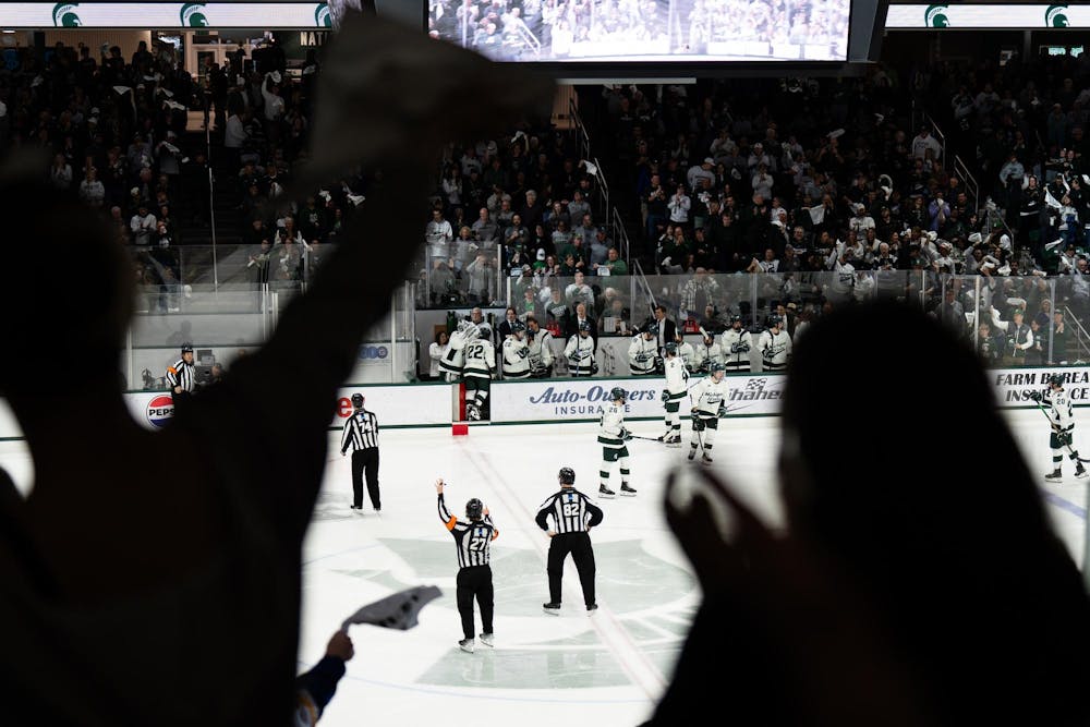 Michigan State fans celebrate the first and only goal of the night during the third period against Notre Dame at Munn Ice Arena on March 15, 2025. The Spartans took a 1-0 victory over the Fighting Irish, advancing to the Big Ten Championship.
