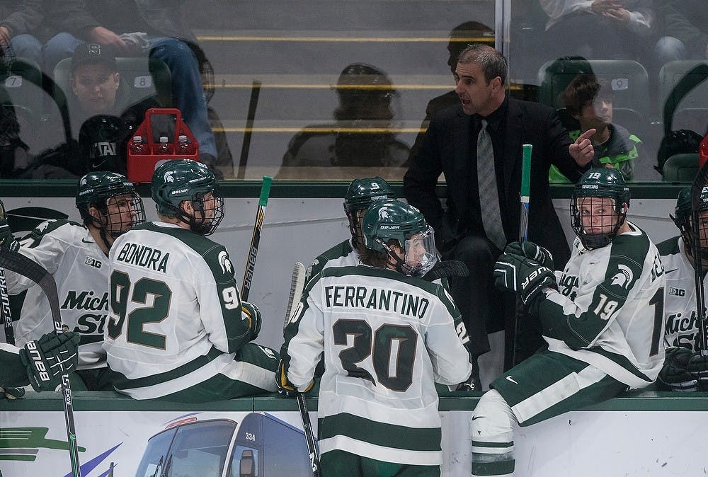 <p>Head coach Tom Anastos speaks to his team Feb. 14, 2015, during a timeout in the game against Penn State at Munn Ice Arena in East Lansing. The Nittany Lions were defeated by the Spartans, 3-2. Emily Nagle/The State News</p>