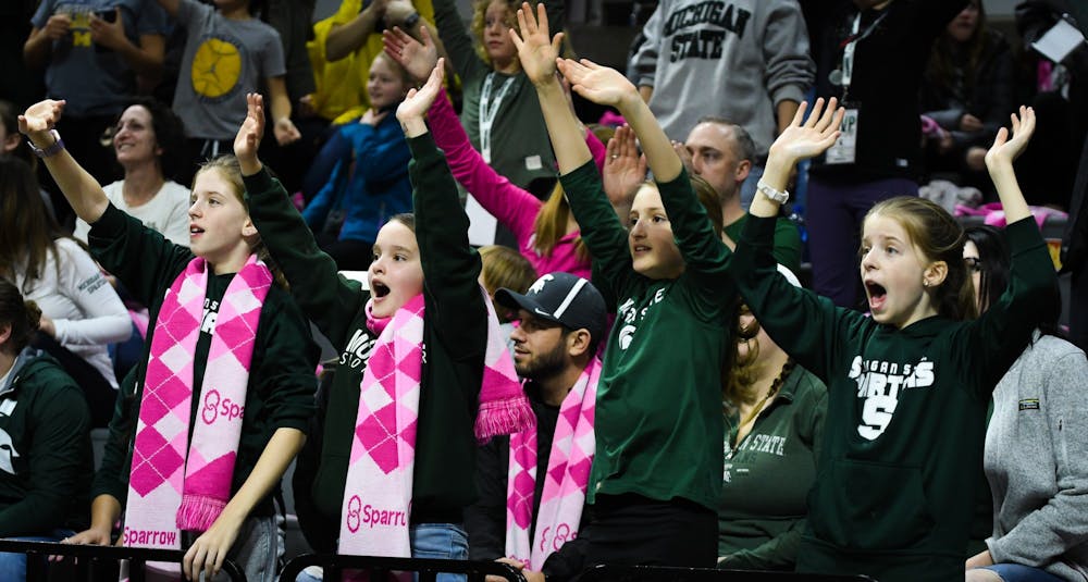 Young Spartan fans cheer during the women's basketball game against Michigan at the Breslin Center on February 23, 2020. The Spartans fell to the Wolverines 65-57. 