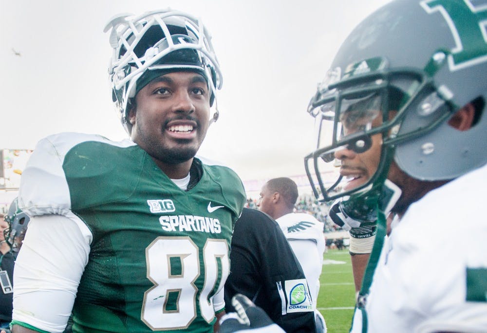 Junior tight end Dion Sims smiles after defeating the Eastern Michigan, 23-7, on Saturday, Sept. 22, 2012 at Spartan Stadium. Sims had one touchdown during the game. Justin Wan/The State News