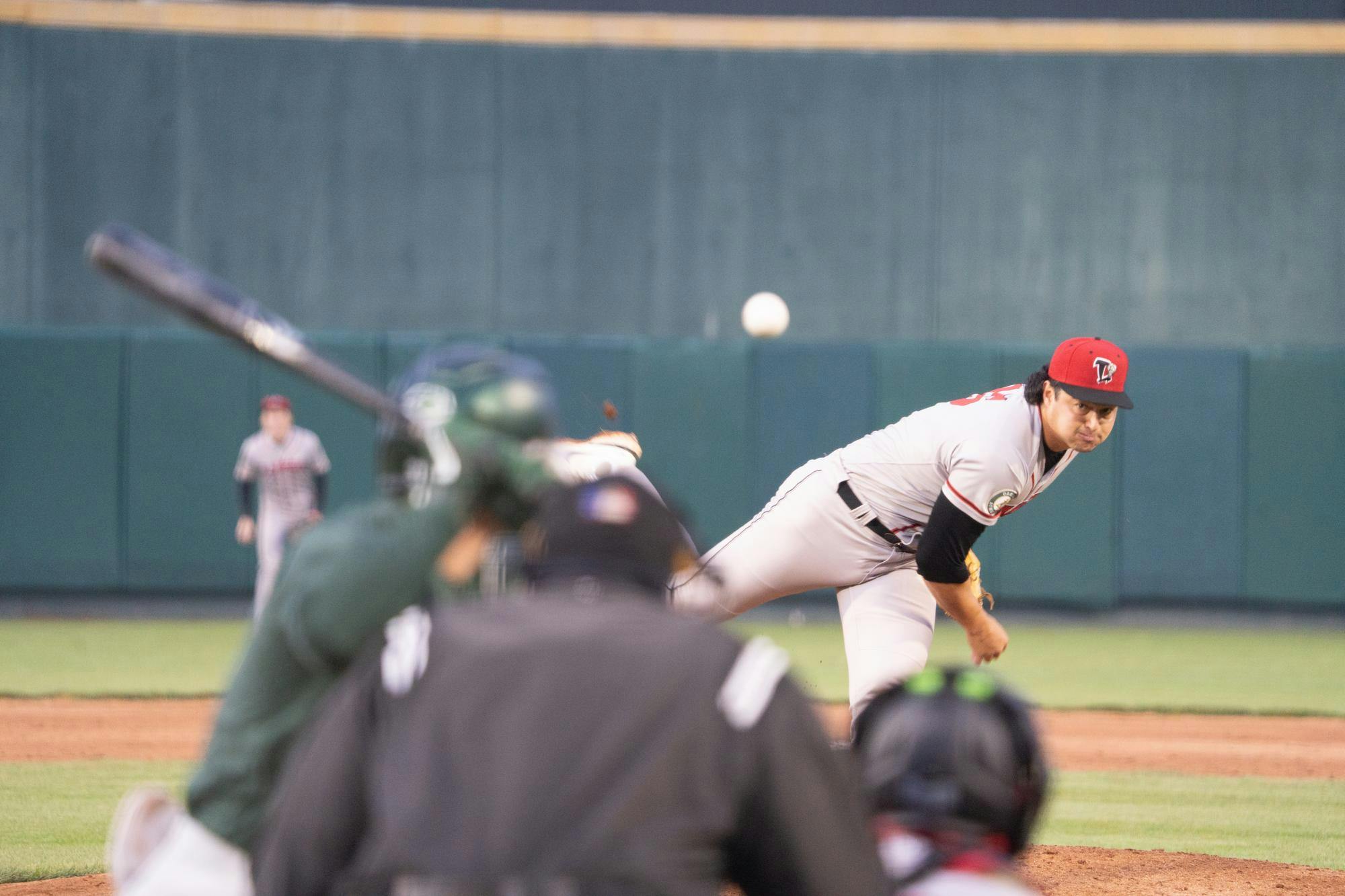 Lansing Lugnuts pitcher Hunter Brealt deals a pitch to a Spartan batter on Wednesday, April 3, 2024 at Jackson Field in Lansing, MI. The Lugnuts beat the Michigan State Spartans 18-0 in the "Cross Town Shodown" exhibition match.