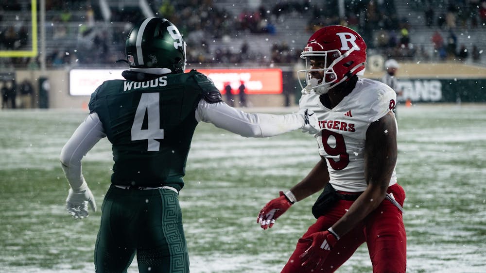 <p>MSU defensive back redshirt junior Ed Woods (4) defends Rutgers wide receiver sophomore Ian Strong (9) at Spartan Stadium on Nov. 30, 2024.</p>