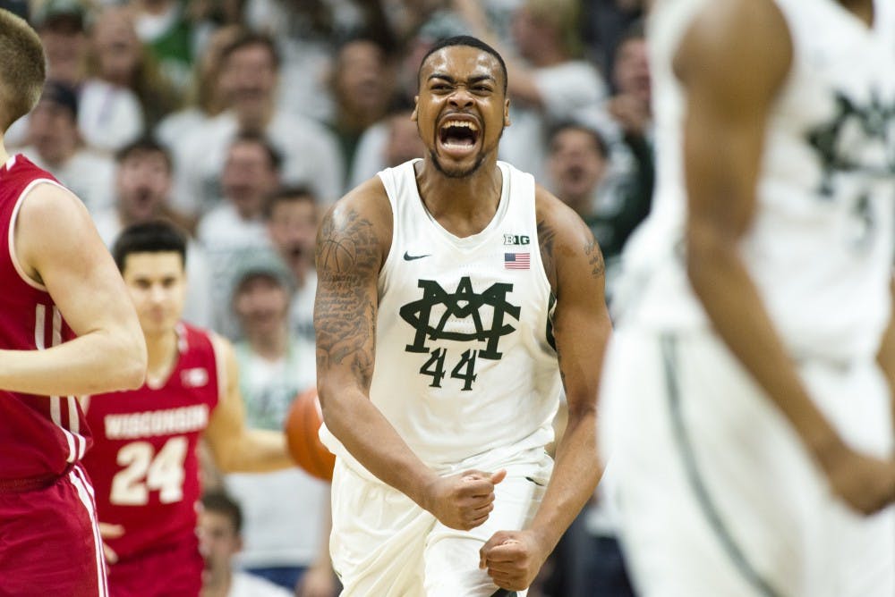 Freshman forward Nick Ward (44) celebrates after scoring during the first half of men's basketball game against the University of Wisconsin on Feb. 26, 2017 at Breslin Center. The Spartans are up at against the Badgers at the half, 38-37.