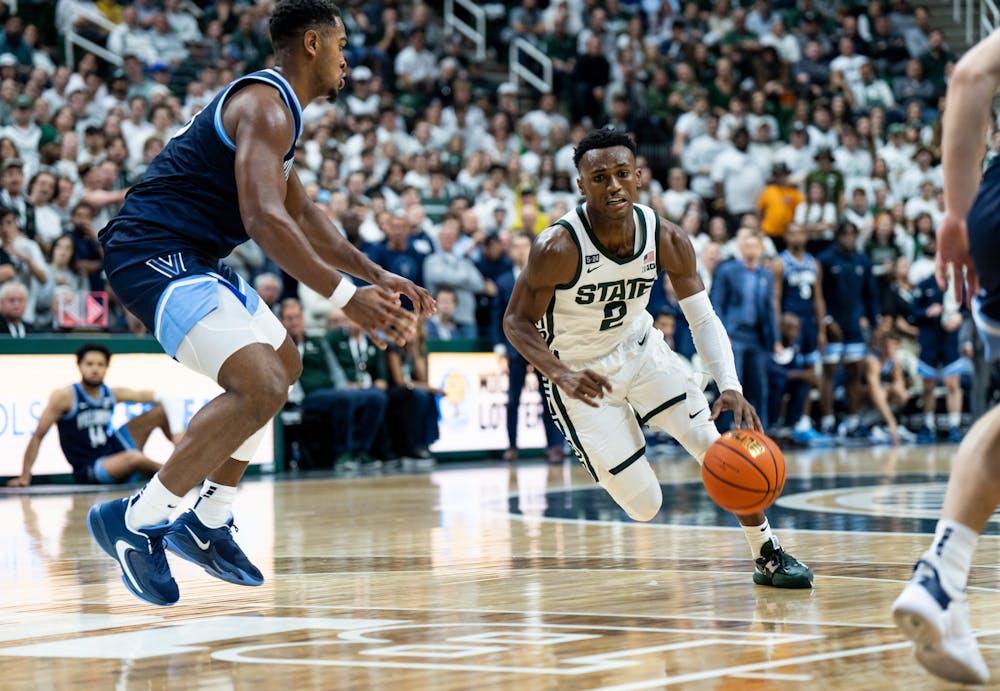 <p>Senior guard Tyson Walker (2) dribbles the ball during a game against Villanova at the Breslin Center on Nov. 18, 2022. The Spartans defeated the Wildcats 73-71. </p>