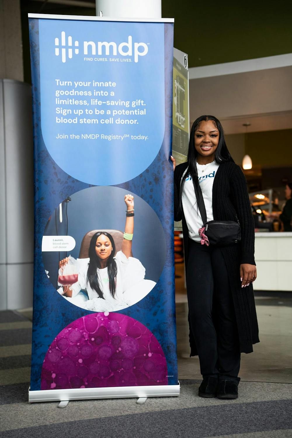 Mychaela Lovelace, a kinesiology senior, poses for a photo in Brody Square on April 12, 2024. Lovelace had her life saved by a bone marrow transplant 15 years ago and now volunteers with the National Marrow Donor Program.