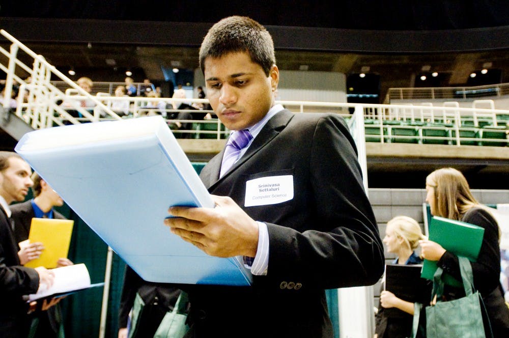 East Lansing resident and recent graduate Srinivasa Settaluri prepares for a face-to-face interview with potential employers at Career Gallery hosted inside Breslin Center Wednesday afternoon. Sponsored by MSU's Career Services Network, the job fair is the biggest this year featuring 225 participating companies. Justin Wan/The State News