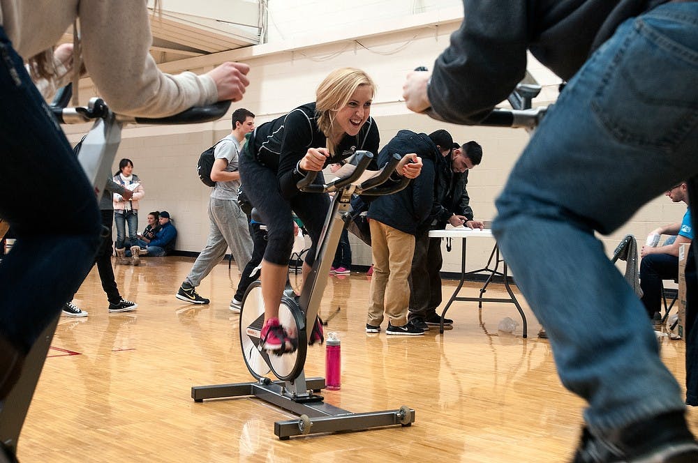 <p>Graduate student Haley Phillips leads group in a spin class Jan. 23, 2015, at Rec Fest at IM Sports West. Allyson Telgenhof/The State News.</p>