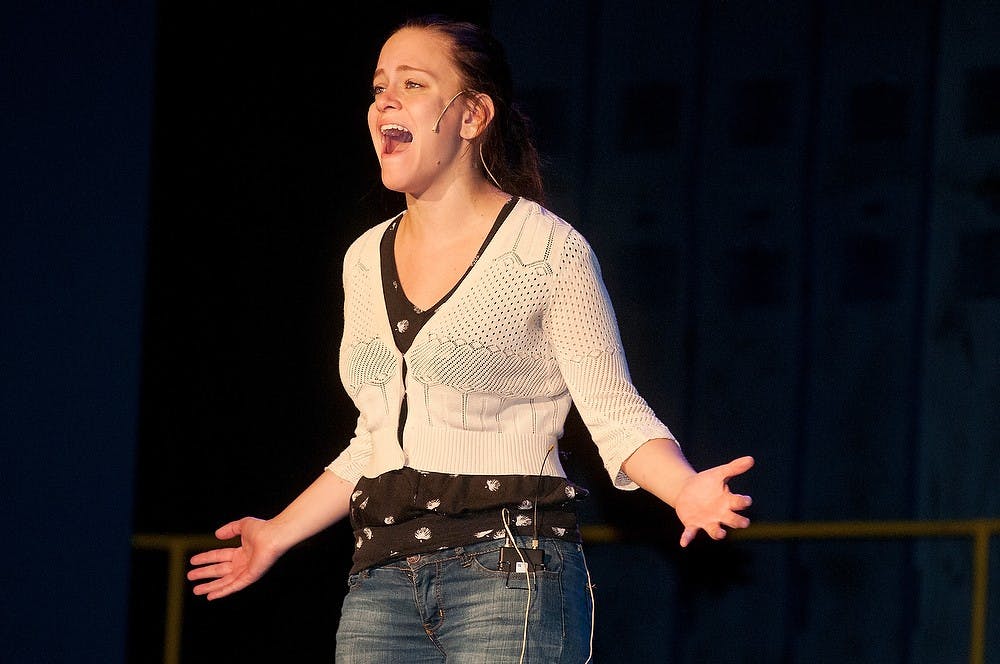 <p>Theater senior Caitlin Dunlap rehearses for Carrie: The Musical on Oct. 6, 2014, at the Wharton Center. Dunlap will play the lead role that she will perform Oct. 10-19.  Aerika Williams/The State News</p>