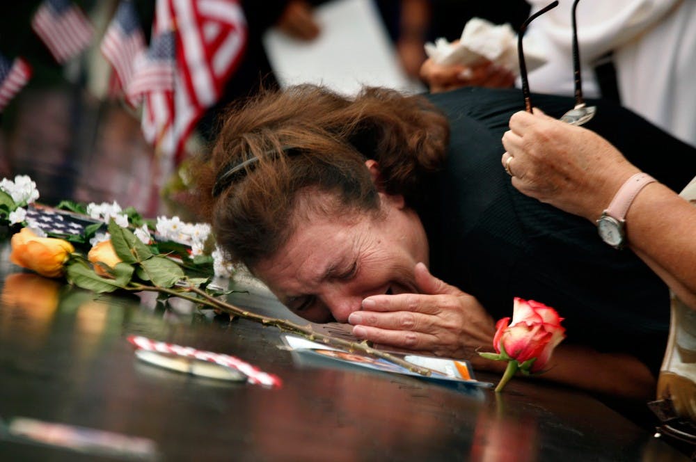 A woman mourns the loss of her son at the World Trade Center Memorial during ceremonies marking the 10th anniversary of the 9/11 attacks on the World Trade Center, in New York, September 11, 2011. (Carolyn Cole/Los Angeles Times/MCT)