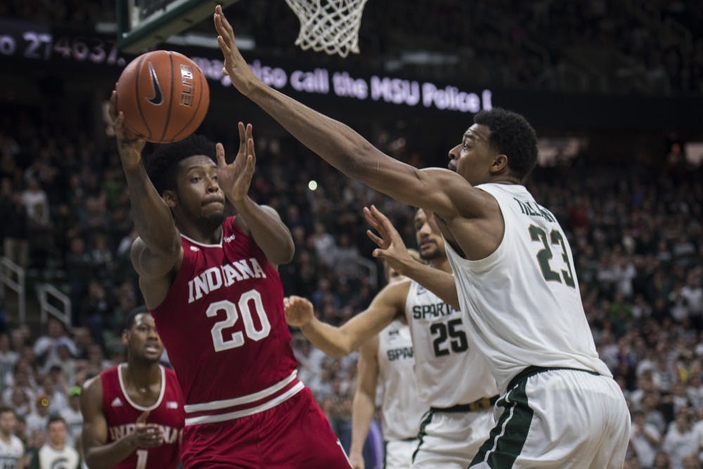 <p>Sophomore forward Xavier Tillman (23) covers Indiana forward De’Ron Davis (20) during the men's basketball game against Indiana on Feb. 2, 2019 at the Breslin Center. Michigan State lost to Indiana in overtime 79-75. Nic Antaya/The State News</p>