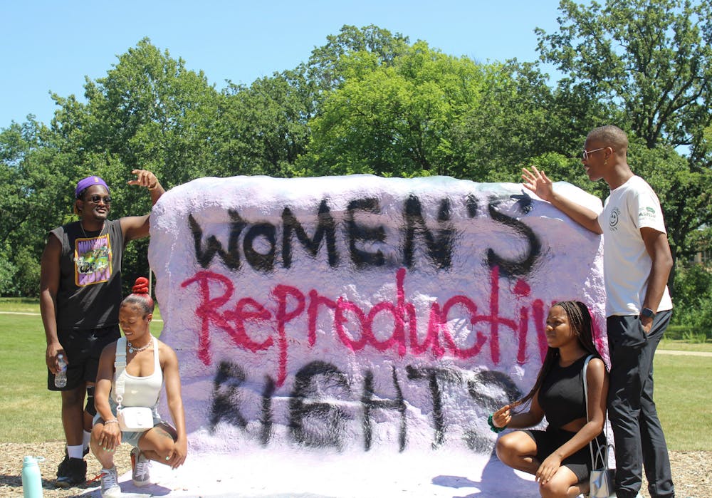 <p>Students gather at The Rock on Farm Lane at an emotional rally to protest the recent overturning of Roe V. Wade on July 10, 2022. </p>