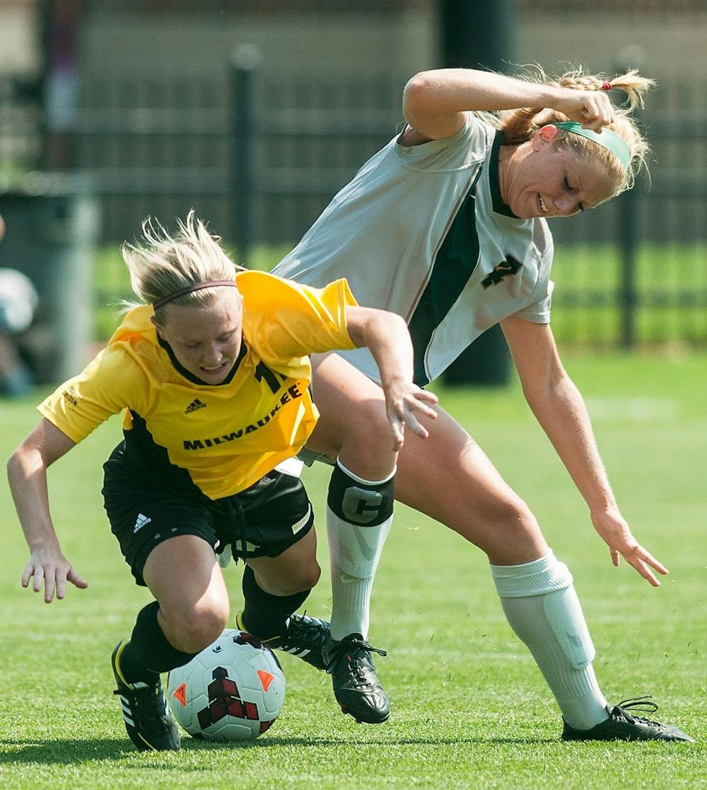 	<p>Junior forward/midfielder Lisa Vogel fights for the ball with Milwaukee defenseman Caity Bestwina during their game, Aug. 25, 2013, at DeMartin Soccer Stadium. The Spartans defeated Milwaukee, 5-2. Danyelle Morrow/The State News</p>