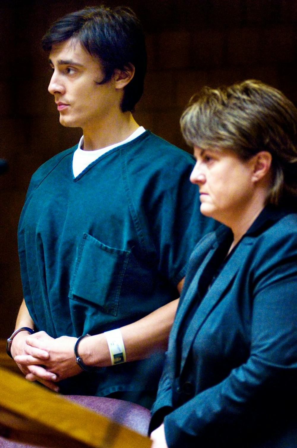 	<p>Graduate student Andrew David Thompson and his lawyer Kimberly Savage stand before Judge Donald Allen Thursday morning at the 55th District Court. Thompson, who admits to beating 10 Italian greyhounds to death, was arraigned in the 55th District Court June 27 for 10 counts of animal killing.</p>