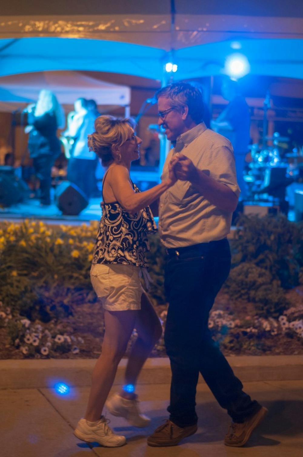 Owosso residents Dawnmarie Mersino, left, and Lehman Orluck dance on June 18, 2016 at the Summer Solstice Jazz Festival in East Lansing Mich. They were dancing to Lady Sunshine and the X Band