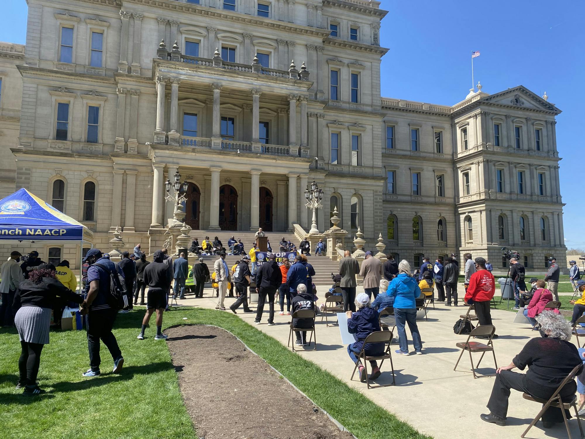 <p>Hundreds gathered on April 13 outside of the Michigan Capitol to protest against the proposed legislation to bring change to voting procedures in Michigan. </p>