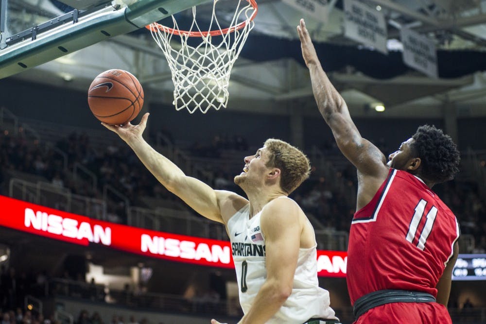 Sophomore guard Kyle Ahrens (0) goes for a layup during the men's basketball game against Youngstown State on Dec. 6, 2016 at Breslin Center. The Spartans led the first half, 37-30.