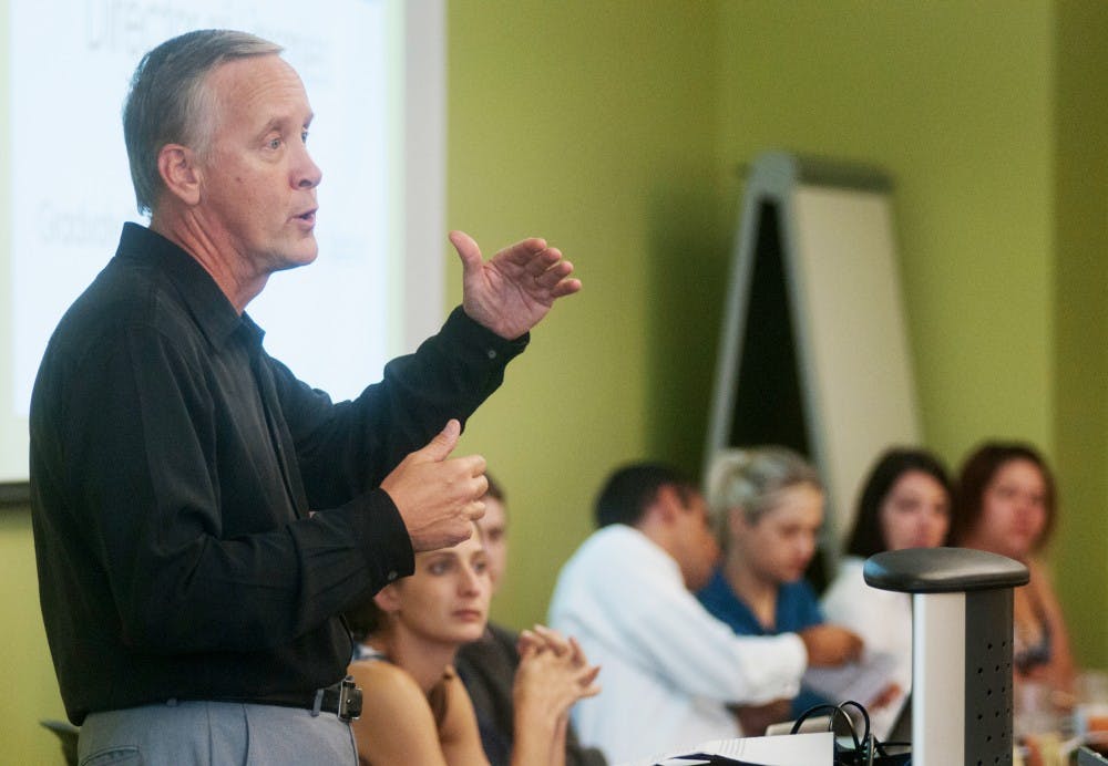 Director of Libraries Cliff Haka speaks to the Council of Graduate Students on Wednesday, Sept. 5, 2012 in a private dining room of Brody Square. Haka discussed the issue of whether or not to designate special graduate student only areas in the library. Julia Nagy/The State News