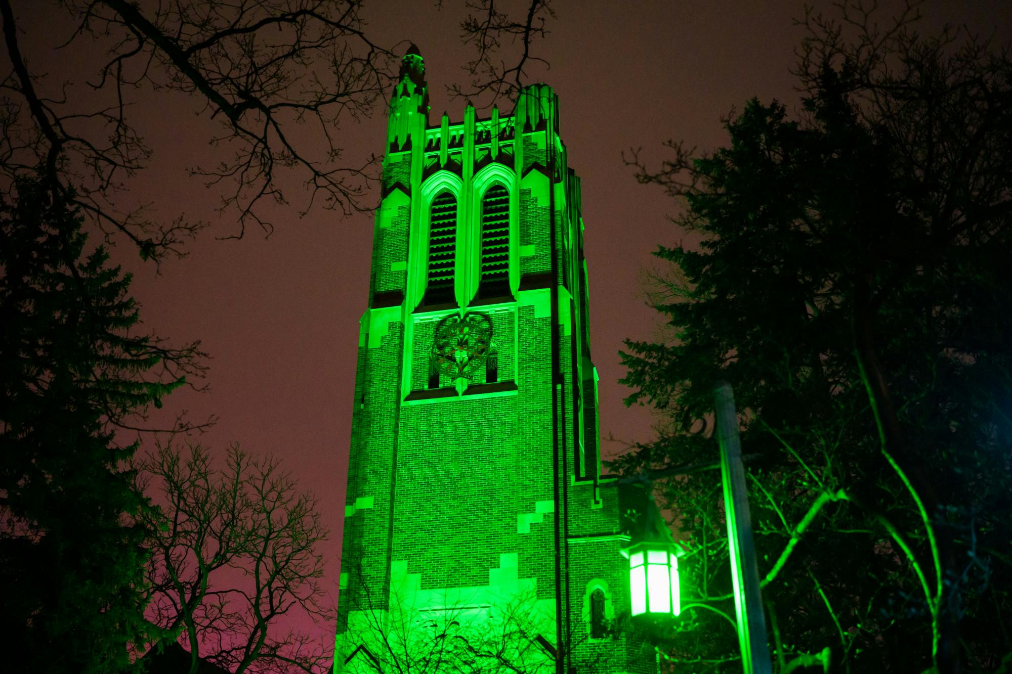 Beaumont Tower on Michigan State University campus lit up green on Feb. 27, 2023 to honor the victims of the mass shooting on Feb. 13, 2023. 