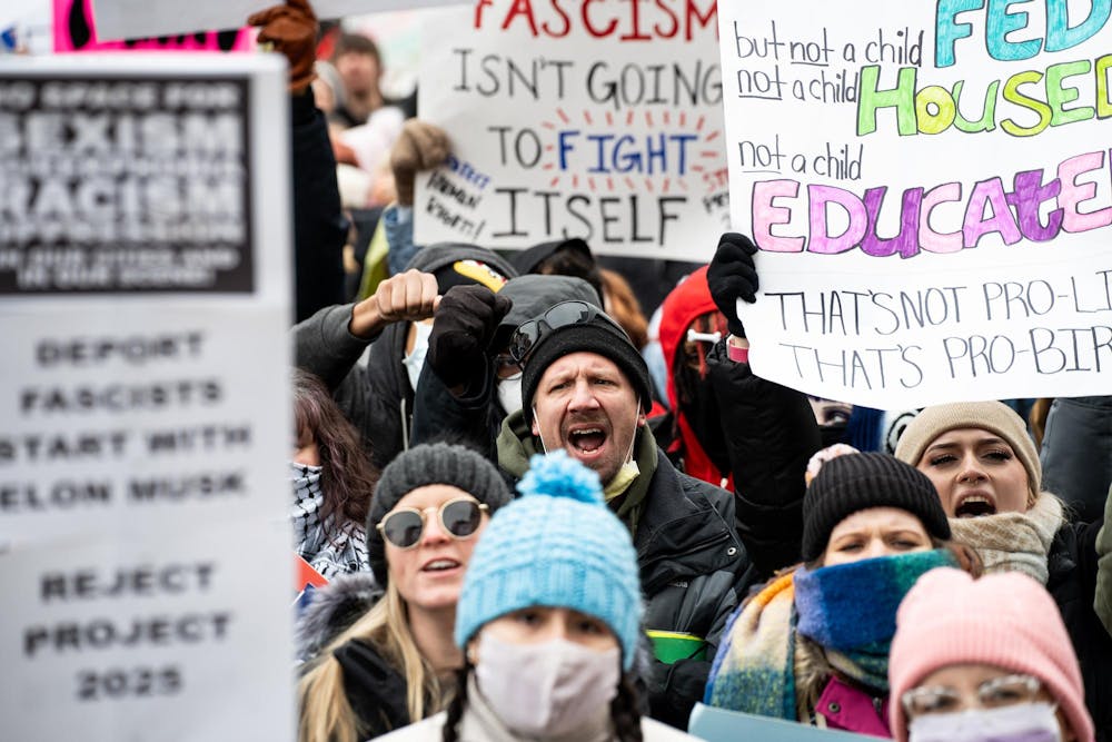 Protesters shout at the Michigan Capitol Building in Lansing, Michigan on Feb. 5, 2025. Protesters gathered at the Michigan Capitol Building to demonstrate against President Donald Trump's cascade of executive orders.