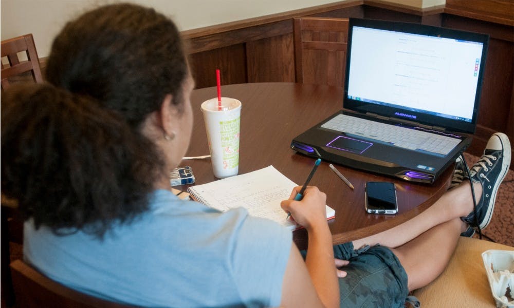 <p>Applied engineering sophomore Angelica Garrido studies Sept. 5, 2015 at Mayo Hall. Wifi in many of the dorms is only available in the lounge areas. Kennedy Thatch/The State News</p>