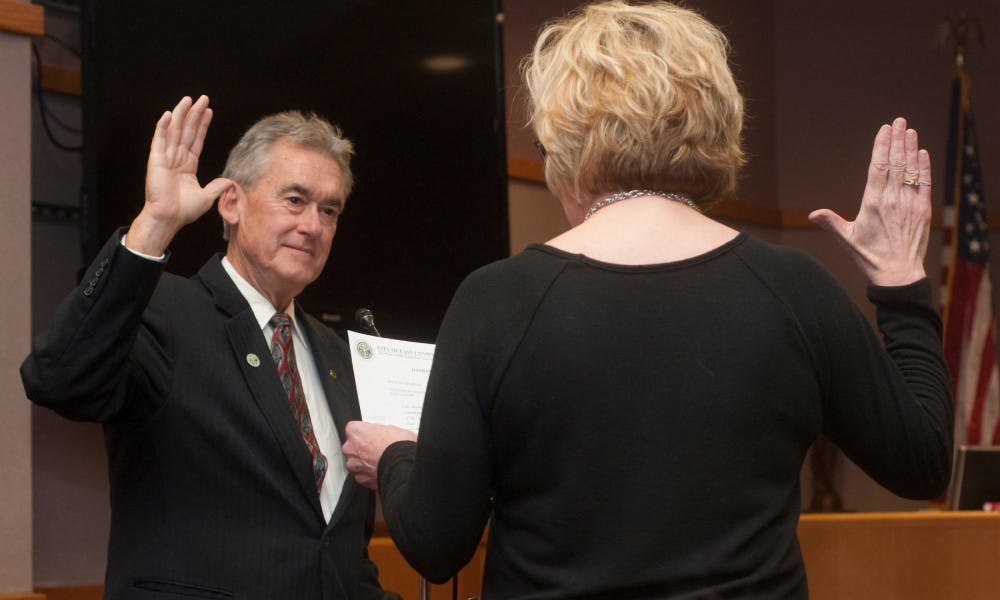 <p>Newly elected mayor Mark Meadows is sworn into city council on Nov. 17, 2015 at East Lansing City Hall. Mayor Meadows was on city council before, from 1995 to 2006, and was mayor for eight of those years.</p>