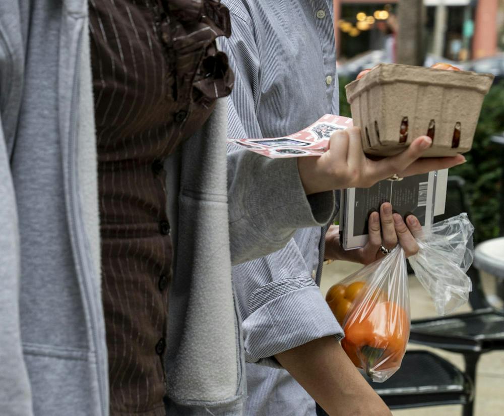 <p>Michigan State students purchase fresh produce from the MSU Culinary Services pop-up tent with produce from the Student Organic Farm in East Lansing, Mich., on Wednesday, Sept. 16, 2026.</p>