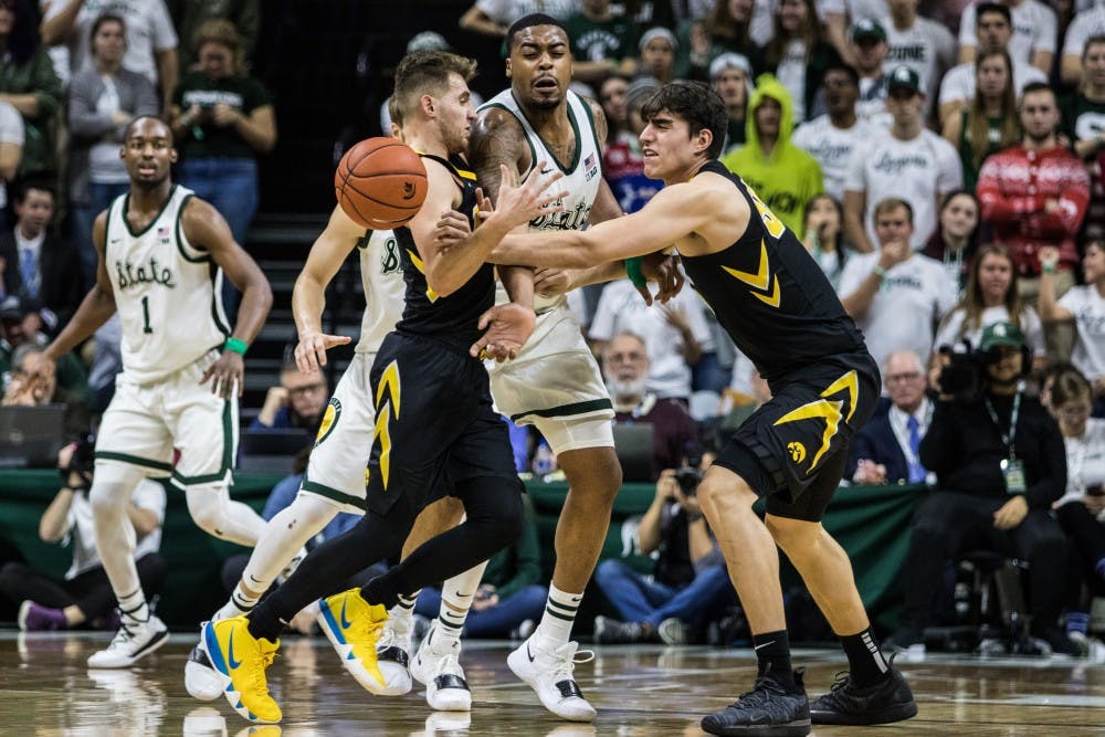 Junior forward Nick Ward (44) tries to block the ball during the game against Iowa University at Breslin Center on Dec. 3, 2018. The Spartans defeated the Hawkeyes, 90-68.