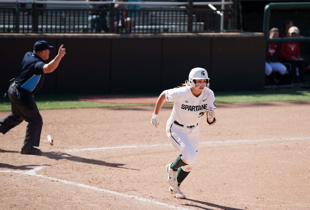 <p>Michigan State sophomore Alexis Barroso running to first after hitting it down the infield line in the third inning. Spartans lost 5-4 against Nebraska, on April 10, 2022.</p>