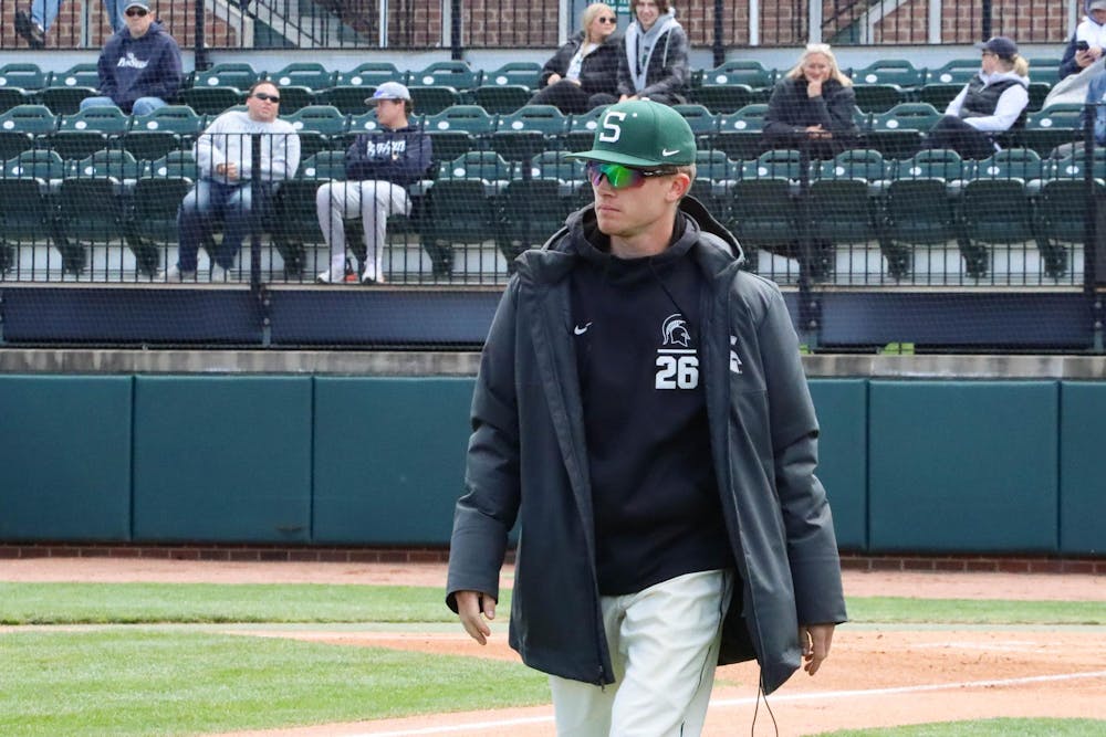 <p>Junior pitcher Dominic Pianto walks to his team in the duggout, moments before the next inning in the matchup against Penn State at McLane Baseball Stadium on April 21, 2024.</p>