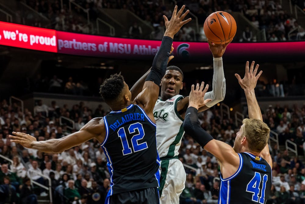 <p>Then-sophomore forward Aaron Henry passes the ball against Duke. The Blue Devils defeated the Spartans, 87-75, at the Breslin Student Events Center on Dec. 3, 2019. </p>